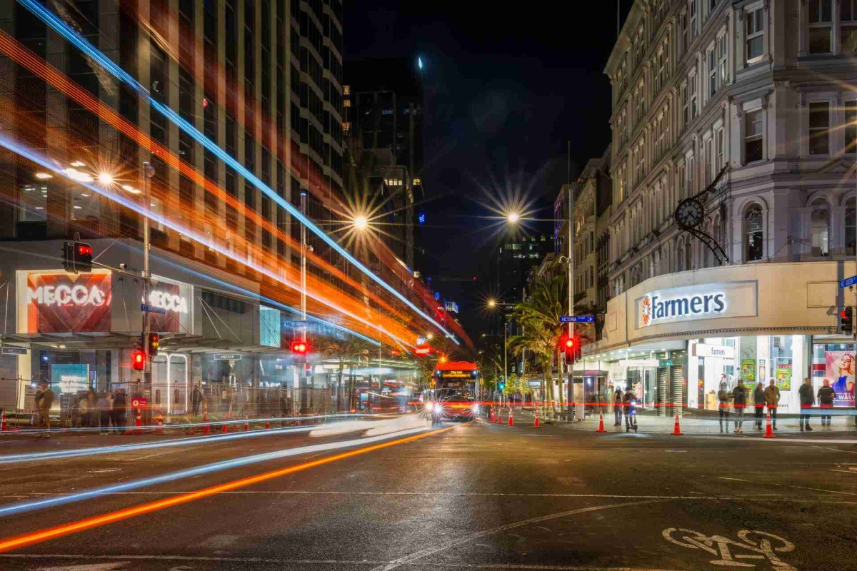 City street at night with lights and people
