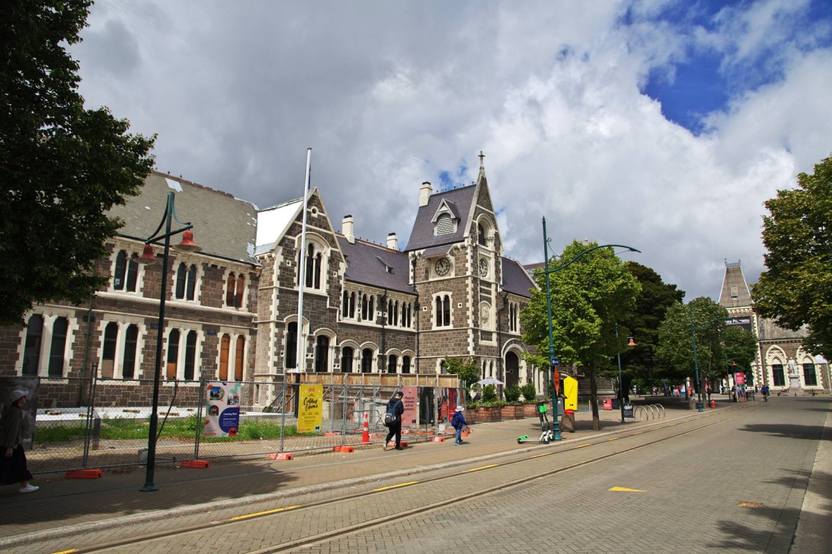 Historic stone buildings in central Christchurch on a partly cloudy day