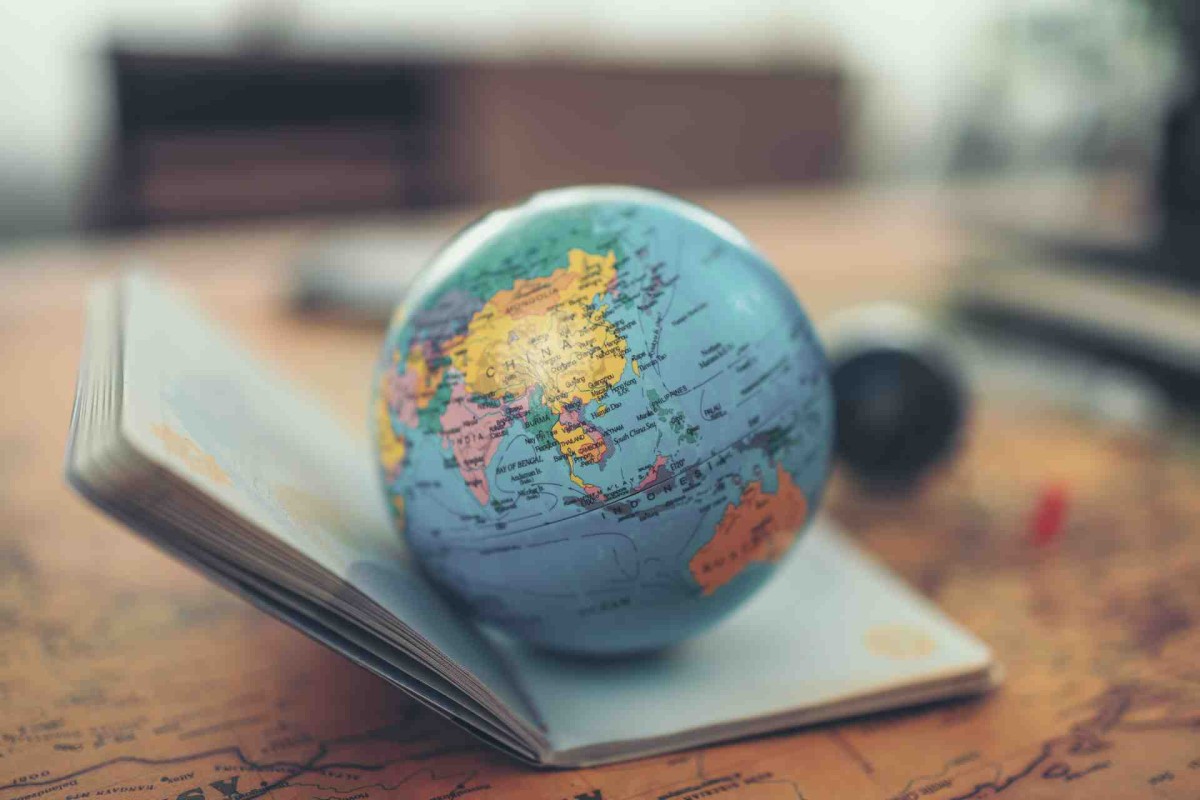 Globe and Passport on World Map