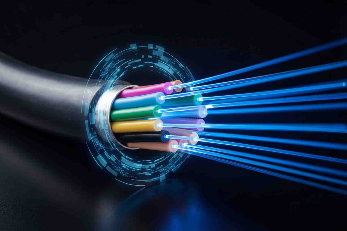 Close-up of a fiber optic cable with glowing colored fibers sending light signals outward