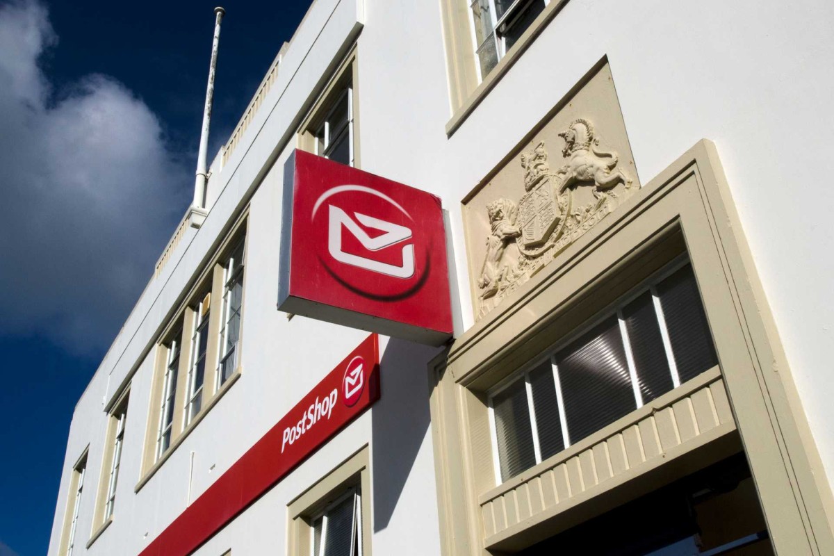 NZ Post sign on the exterior of an urban post office building