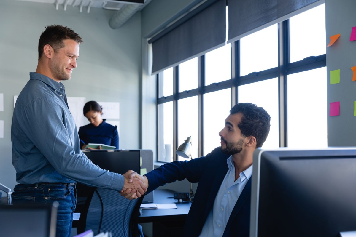 Two guys shaking each other's hands