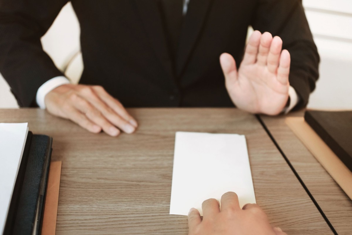 business offer refused by man at the desk