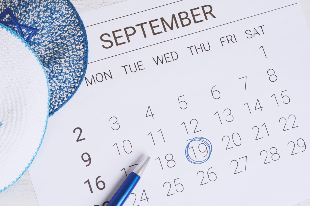 September calendar with the 19th circled in blue beside a blue pen, representing a date during Blue September.